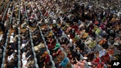 Members of the Afghan Loya Jirga are seated during the first day of the Loya Jirga, or the consultative council in Kabul, Afghanistan, April 29, 2019