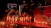 People light candles to remember the victims of an attack on the Army Public School in 2014. The candlelight vigil was held in Peshawar, Pakistan, Dec. 15, 2016. 