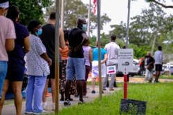 Florida eyaletinin Miami kentinde de seçmenler erken oy kullanmak için uzun kuyruklar oluşturdu.