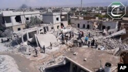 Nhà cửa ở thị trấn Qusair, Homs, bị phá hủy trong một cuộc oanh kích của quân đội chính phủ Syria, ngày 21/5/2013. 