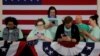 Supporters of Democratic 2020 U.S. presidential candidate and U.S. Senator Elizabeth Warren (D-MA) look at their mobile phones before she speaks at her Iowa Caucus rally in Des Moines, Iowa, U.S., February 3, 2020. Picture taken February 3, 2020. REUTERS…