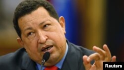 Tổng thống Venezuela Hugo Chavez nói chuyện tại một cuộc họp báo trong thủ đô Caracas của Venezuela sau khi tái đắc cử, 9/10/12