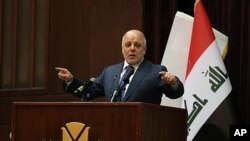 Thủ tướng Iraq Haider al-Abadi phát biểu trong cuộc họp báo loan báo chiến thắng cuộc chiến ba năm chống IS, ở Baghdad, Iraq, ngày 9 tháng 12, 2017.