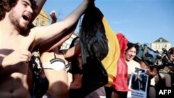 People stripped down to their underwear hold a Belgian flag during a government action in Ghent, Belgium on Thursday, Feb. 17, 2011. While politicians wallow in Belgium's longest political crisis which pits the leaders of 6 million Dutch-speaking Flemings