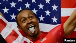 Aries Merritt of the U.S. celebrates after winning gold in the men's 110m hurdles final.