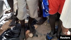 People with chained legs are pictured after being rescued by police in Sabon Garin, in Daura local government area of Katsina state, Nigeria, Oct. 14, 2019. 