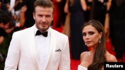 David and Victoria Beckham arrive at the Metropolitan Museum of Art Costume Institute Gala Benefit celebrating the opening of "Charles James: Beyond Fashion" in Upper Manhattan, New York, May 5, 2014. REUTERS/Lucas Jackson (UNITED STATES - Tags: ENTERTA