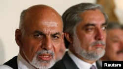 Hai ứng cử viên tổng thống Afghanistan, ông Abdullah Abdullah và ông Ashraf Ghani (trái).